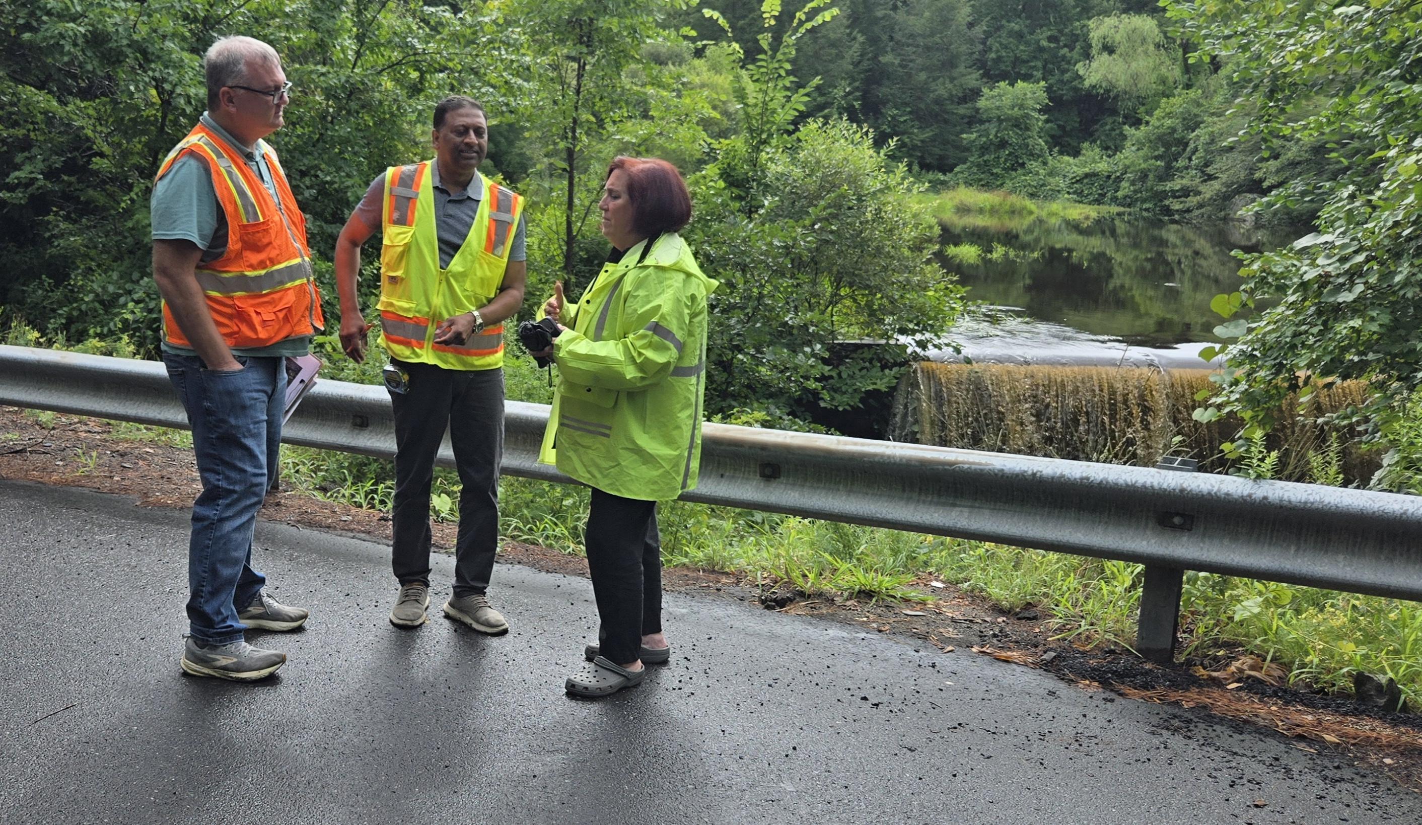 First Selectman Carol R. Goldberg discusses inspection findings with engineers from SLR Consulting.